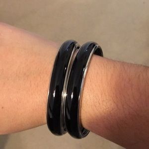 Two black enamel bangles